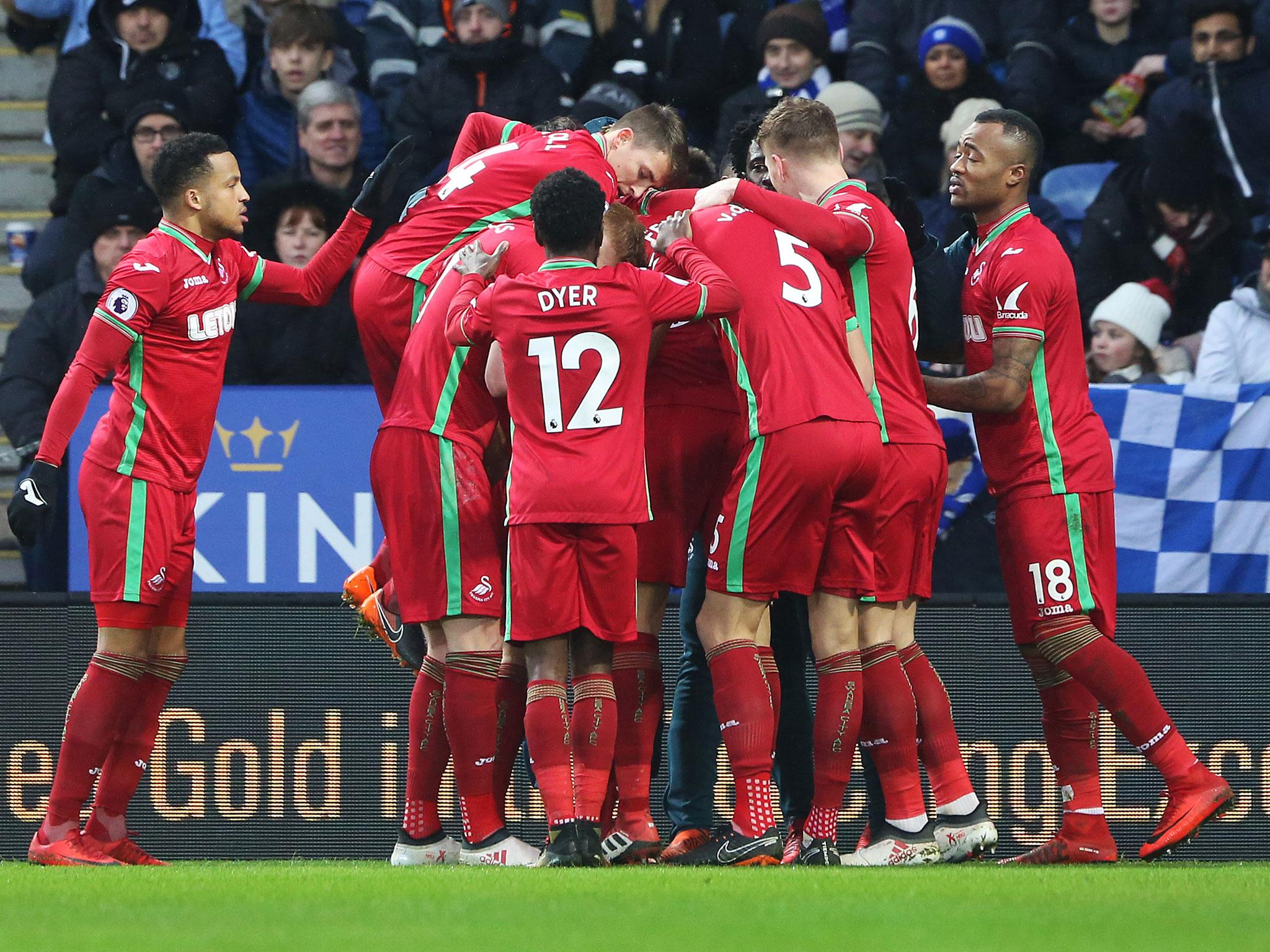 Swansea's players congratulate Federico Fernandez after his equaliser