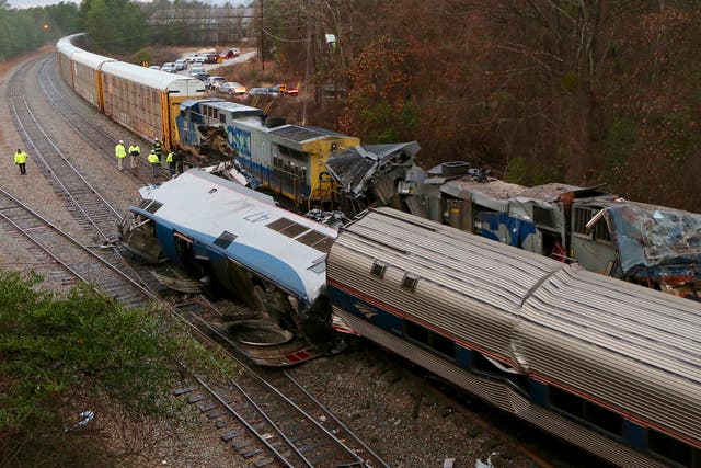 Authorities investigate the scene of a fatal Amtrak train crash in Cayce, South Carolina.