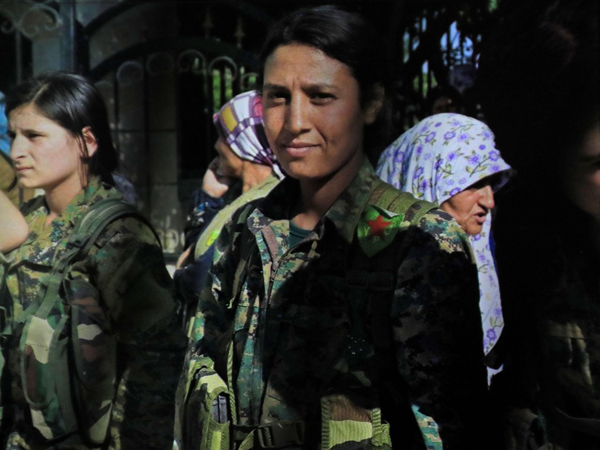 Barin Kobani, centre, was killed in action in Qurna early this week