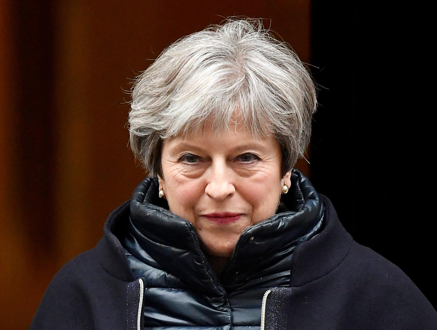 Theresa May has sought to quell discontent among Tory backbenches who fear she is pursuing a soft Brexit