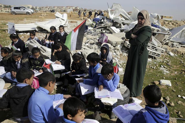 Bedouin children attend improvised class in the village of Abu Nuwar, West Bank, after the Israeli army demolished their two-classroom school in the West Bank on Sunday