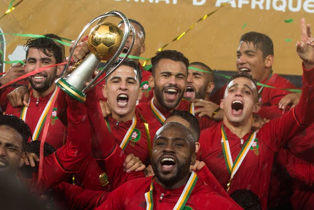 Morocco's Badr Banoun holds up the CHAN trophy