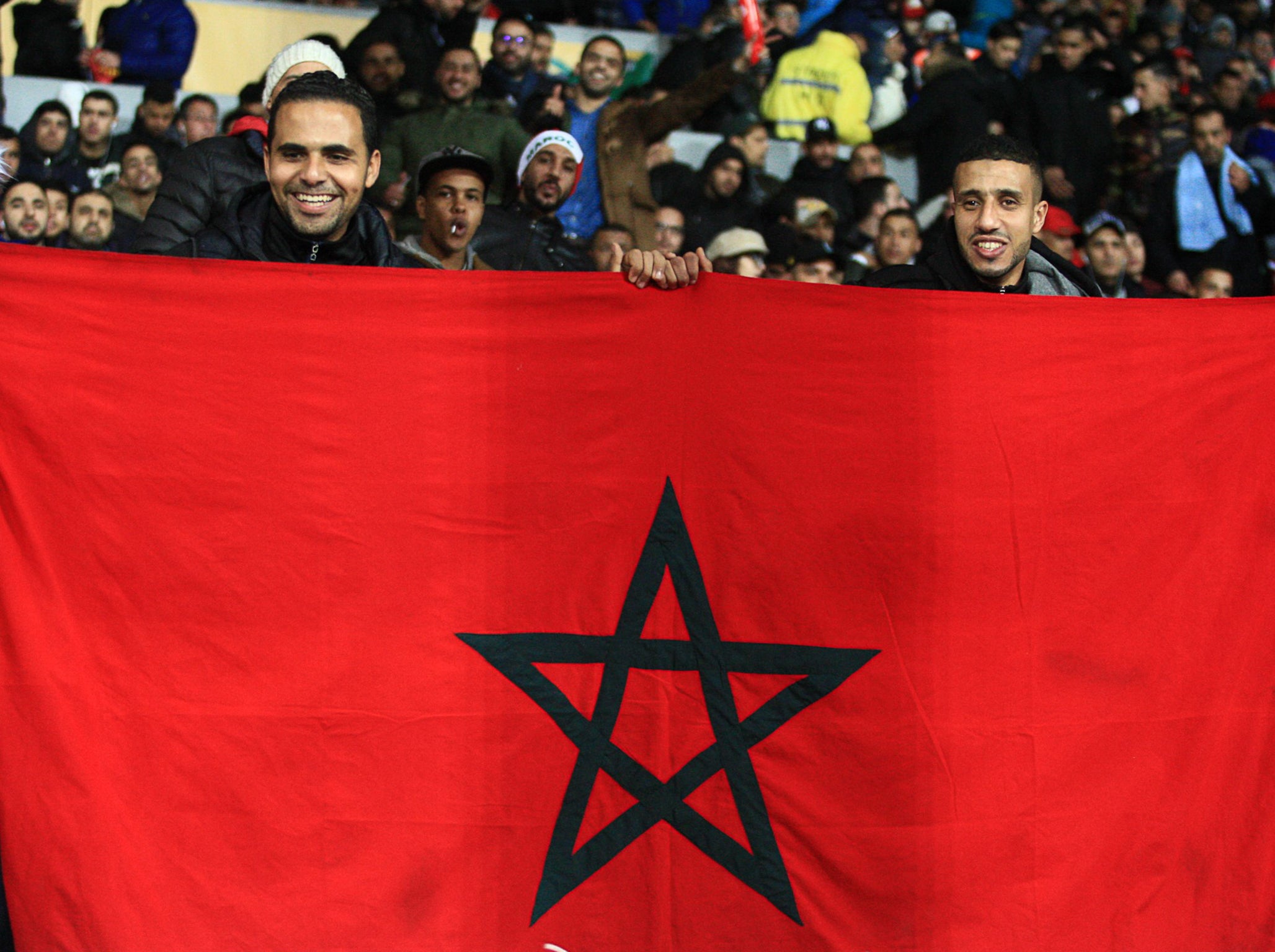 Moroccan supporters watch on