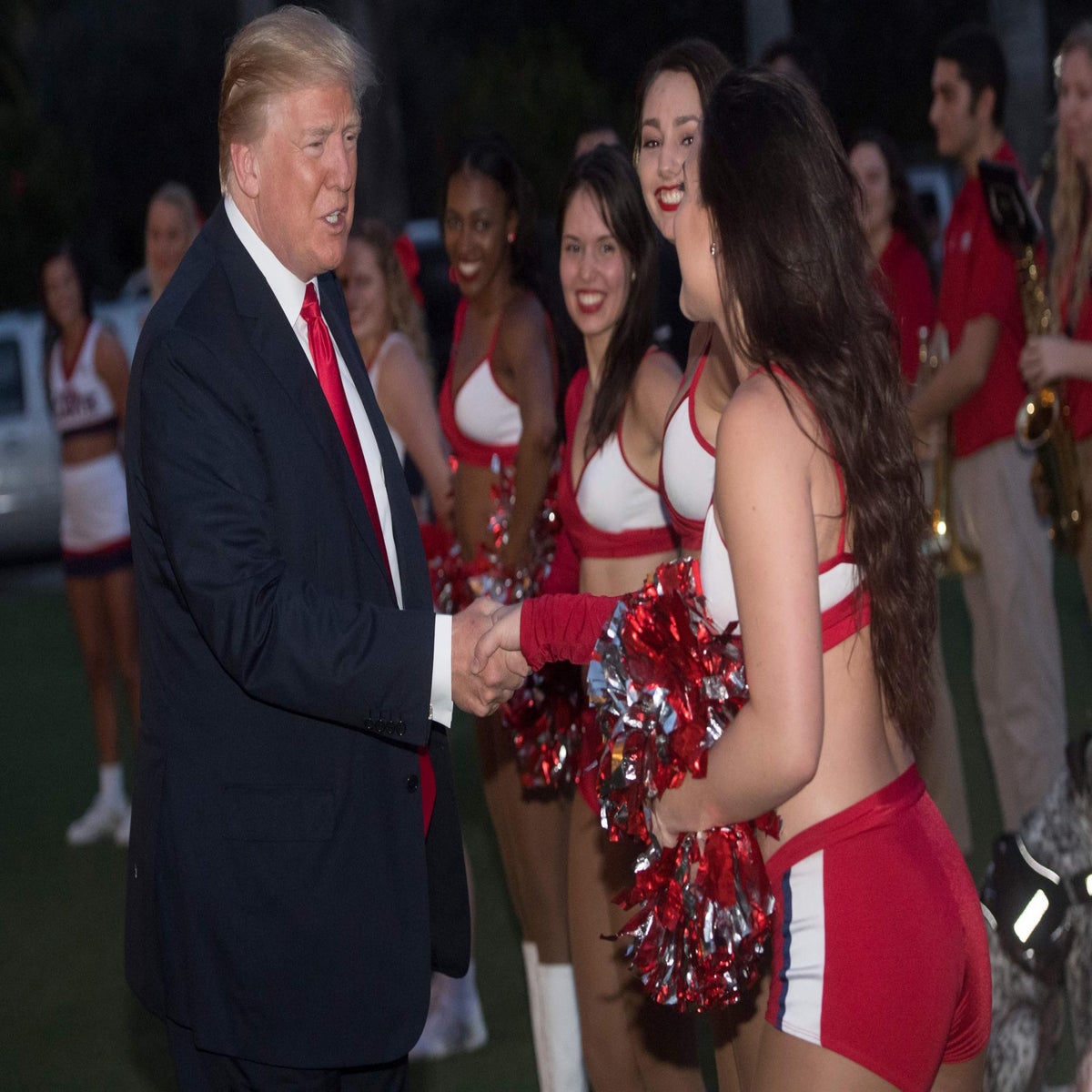 Donald Trump greets cheerleaders ahead of Super Bowl while Melania looks on  | The Independent | The Independent