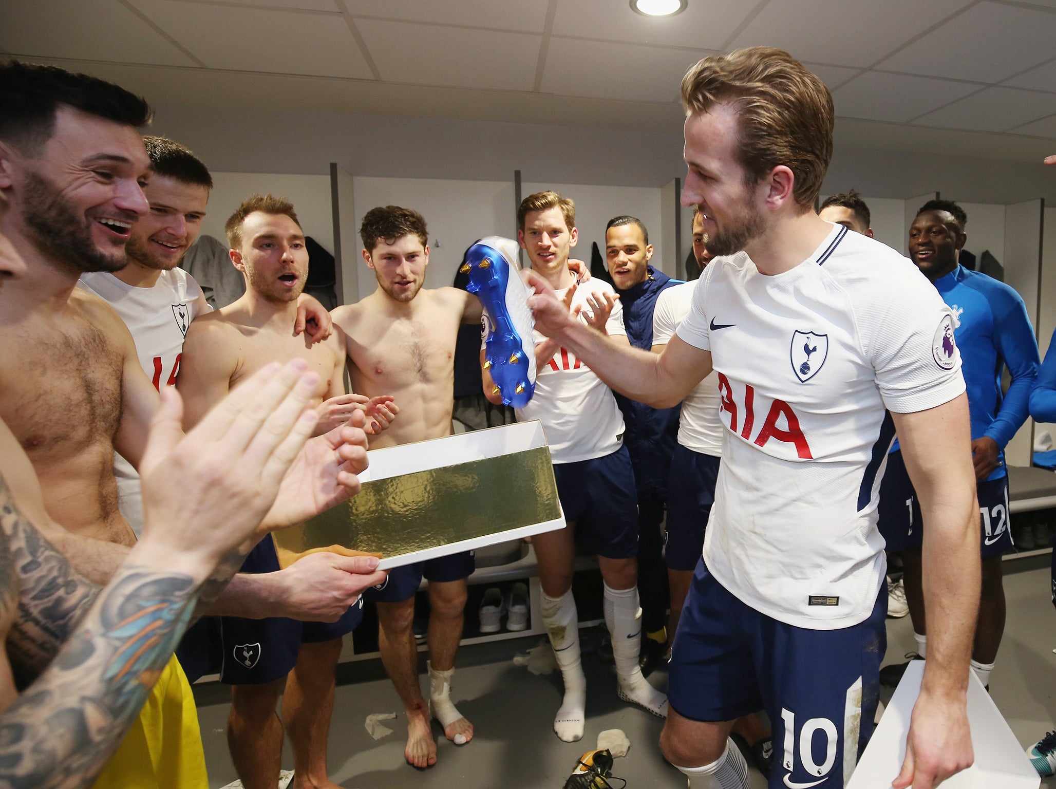 Kane being congratulated by his team-mates