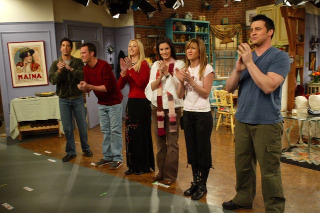The Friends cast on the set of their sprawling apartment - the real life location is less impressive