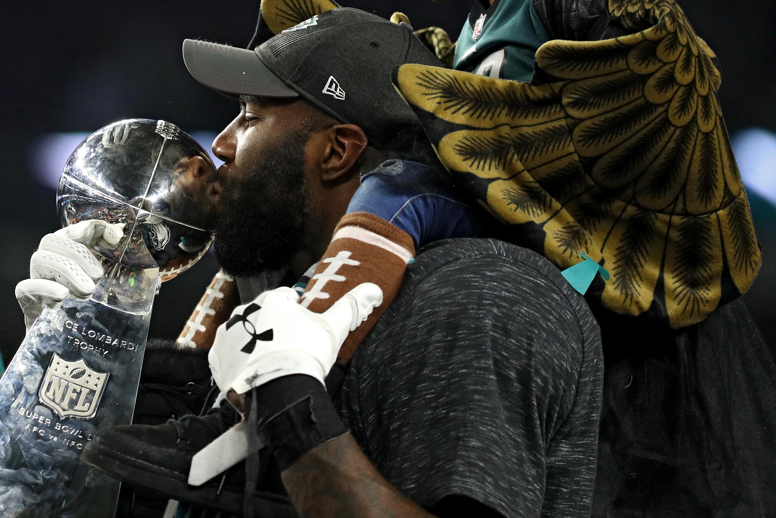 Malcolm Jenkins kisses the Lombardi trophy after winning the Super Bowl