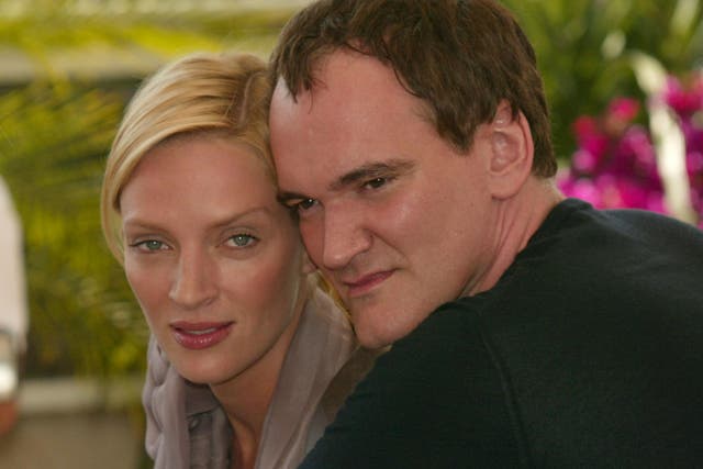 Uma Thurman and Quentin Tarantino at the photocall for Kill Bill 2 at The 57th Annual Cannes Film Festival in 2004