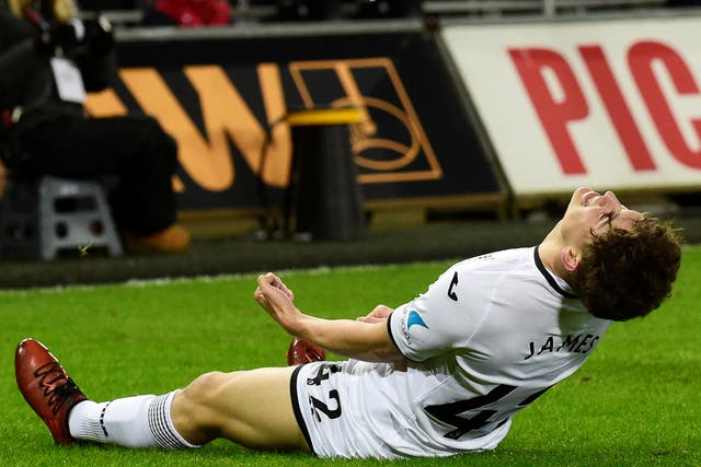 Swansea City's Daniel James celebrates scoring the club's eighth goal against Notts County