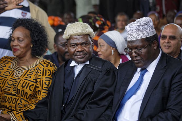 Miguna Miguna, right, attended a mock 'swearing-in' ceremony for opposition leader Raila Odinga at Uhuru Park in Nairobi at the end of January