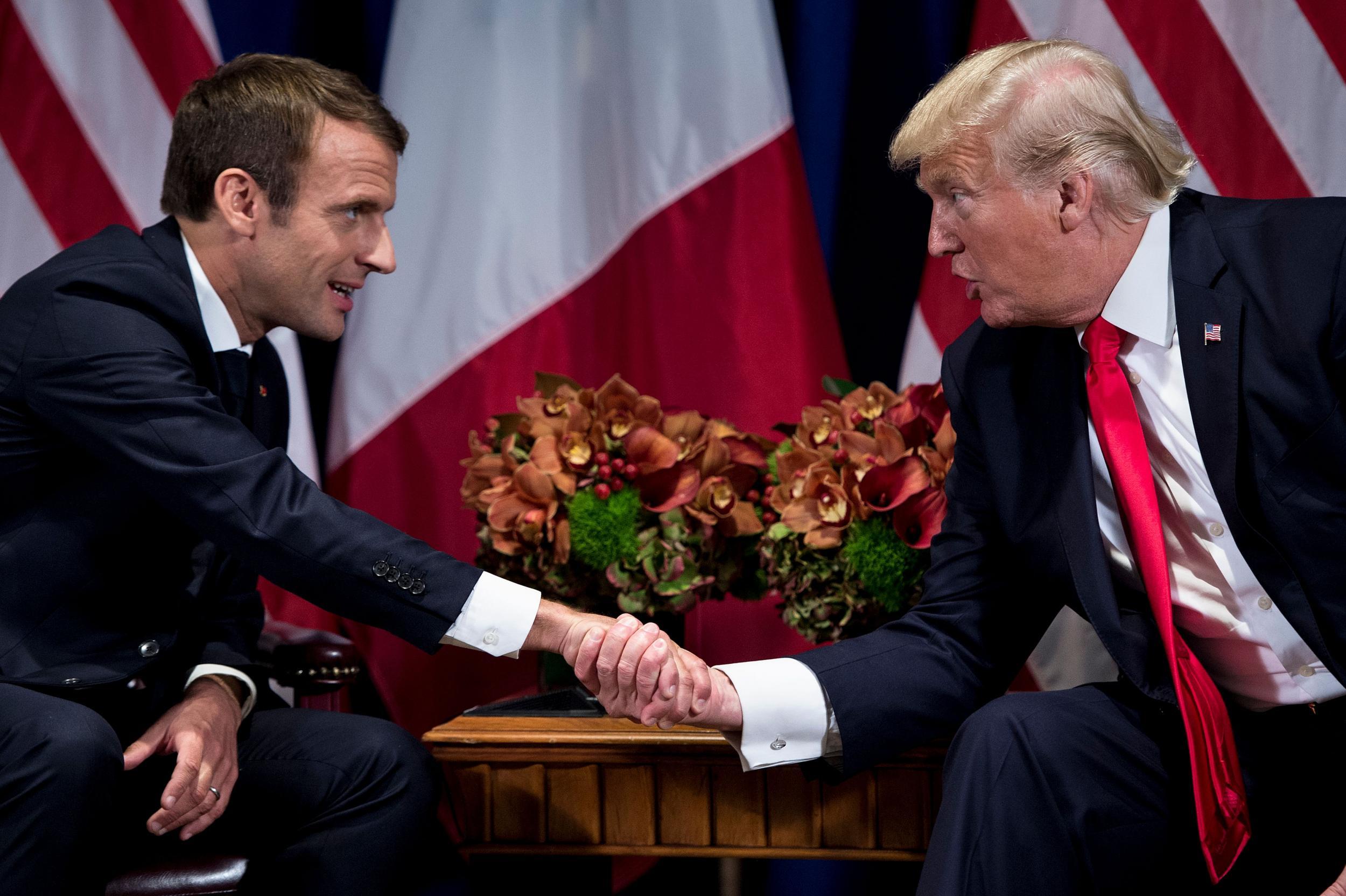 Emmanuel Macron and Donald Trump shake hands at a UN meeting