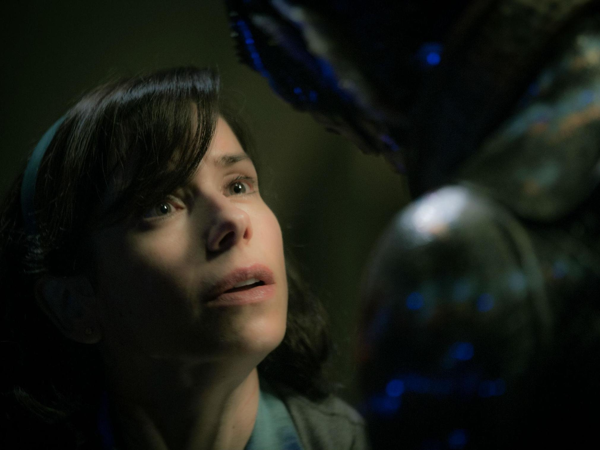 ‘The Shape of Water’ stars Sally Hawkins as a mute, isolated woman who works as a cleaning lady in a high-security government laboratory in 1962 Baltimore