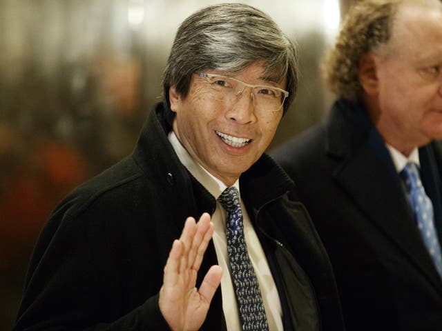 <p>Pharmaceuticals billionaire Dr. Patrick Soon-Shiong waves as he arrives in the lobby of Trump Tower for a meeting with President-elect Donald Trump.</p>