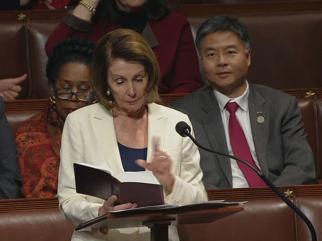 Nancy Pelosi reads from the bible during a marathon speech on the floor of the House of Representatives