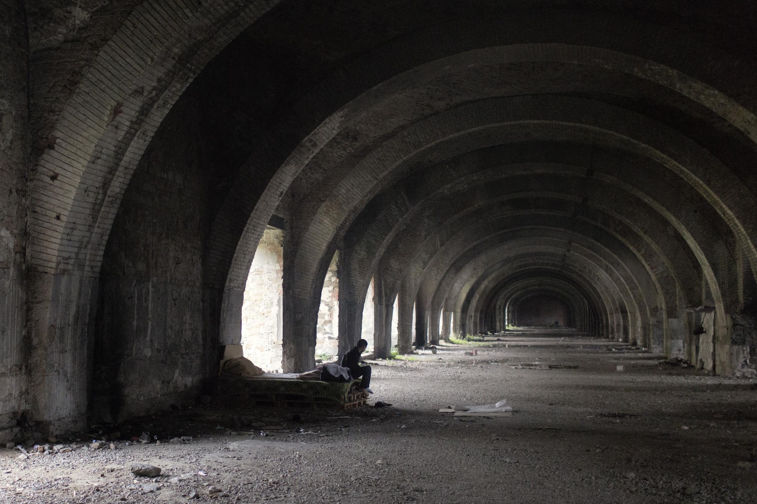 Migrants camp out in abandoned railway silos in Trieste, north-east Italy (Alessandro Penso/MAPS )