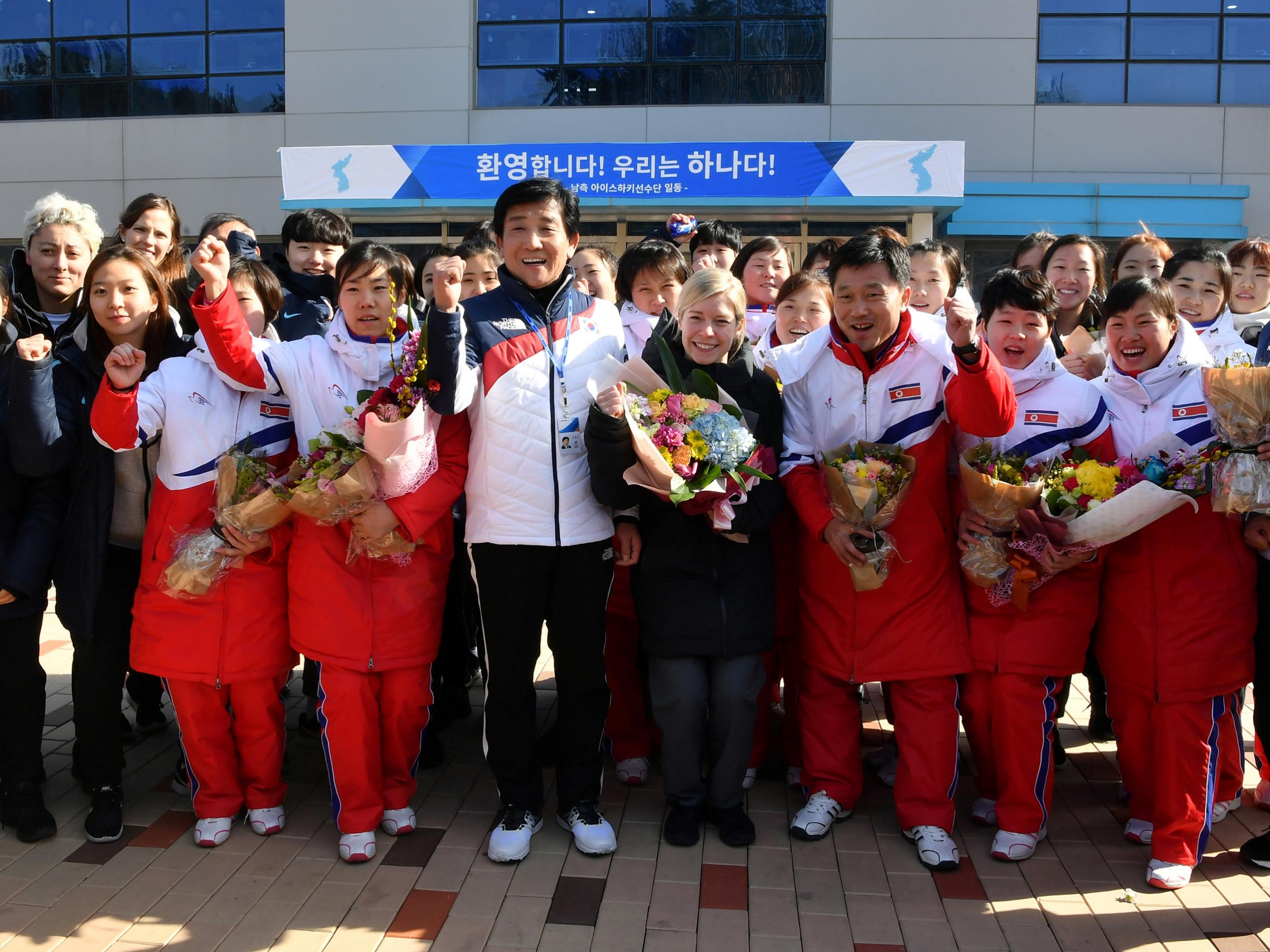 The combined women’s hockey team pose with head coach Sarah Murray (centre), as players from the North arrive at South Korea’s national training centre