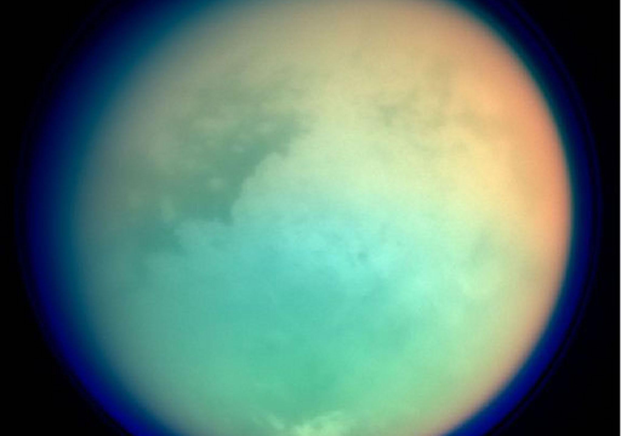 This undated NASA handout shows Saturn's moon, Titan, in ultraviolet and infrared wavelengths
