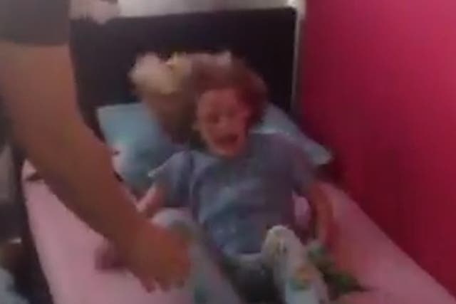 A frame from Samantha Mildon's video of her daughter Bella during a meltdown