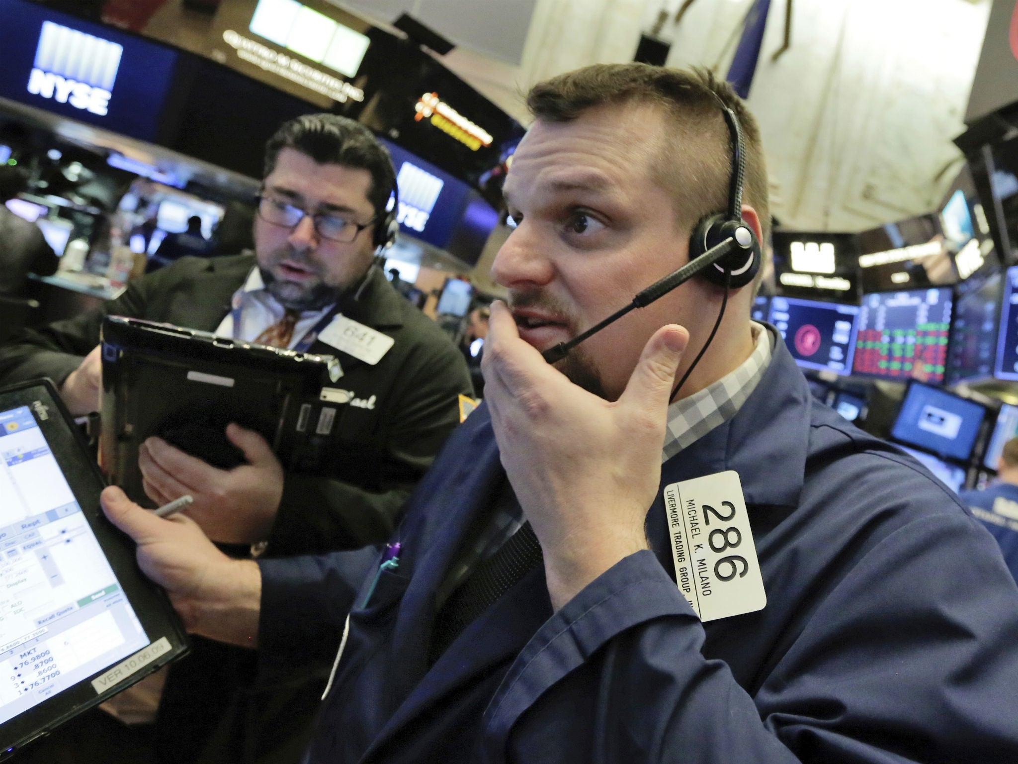 Traders work the floor of the New York Stock Exchange