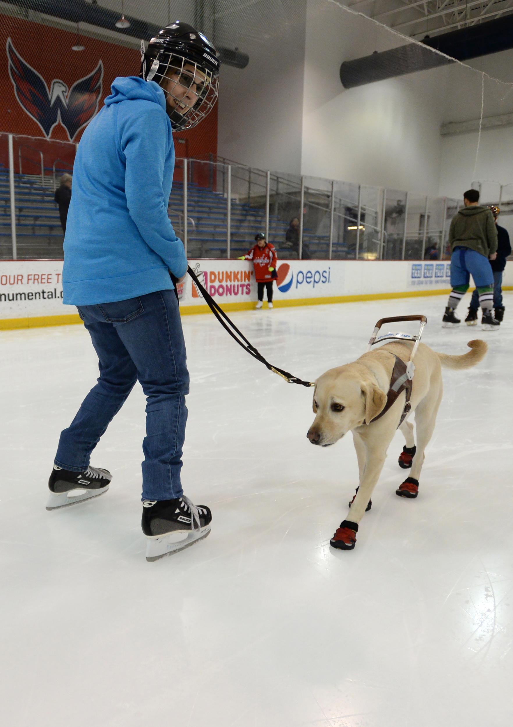 Emily Molchan skates with guide dog Remington