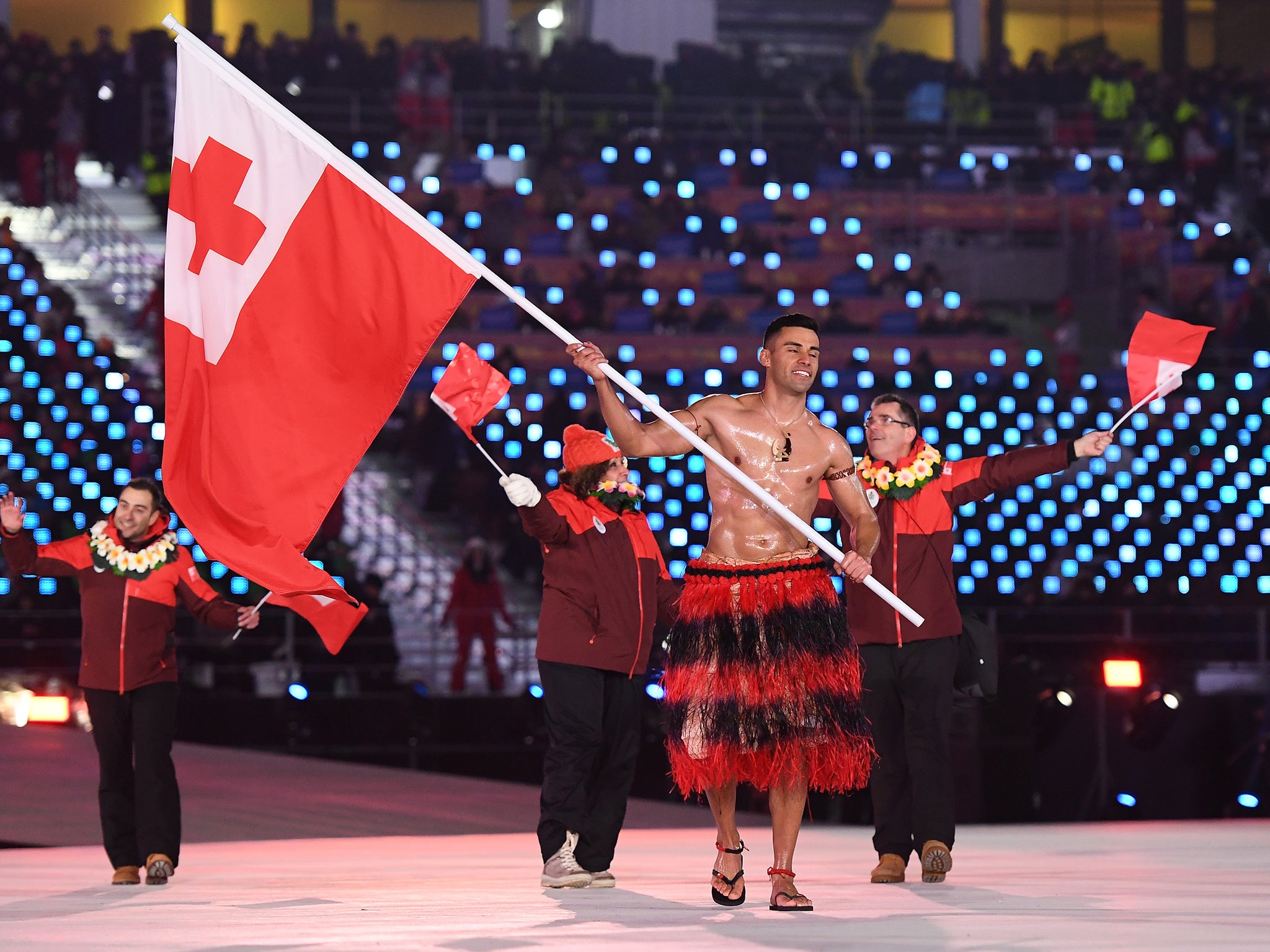 Pita Taufatofua walks out at the Winter Olympics opening ceremony topless despite temperatures dipping to -1 Celsius