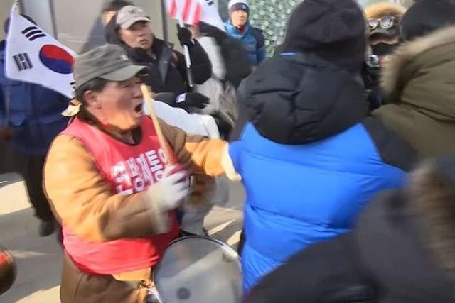 Protesters clashed with police during outside the Olympic stadium during a demonstration against North Korea's involvement in the Winter Olympics