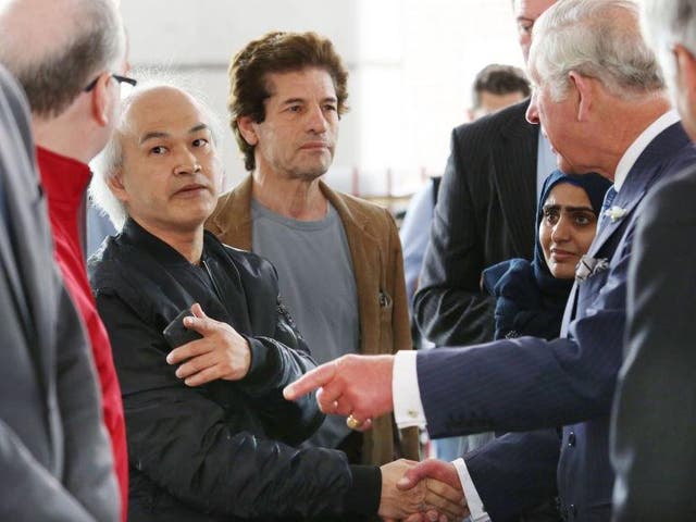 Anh Nhu Nguyen (left, dark shirt) meeting Prince Charles with the real Grenfell victims at the Westway Sports Centre in the aftermath of the disaster