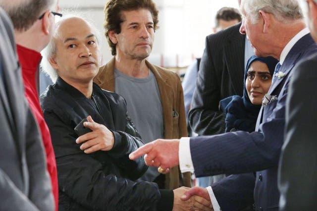Anh Nhu Nguyen (left, dark shirt) meeting Prince Charles with the real Grenfell victims at the Westway Sports Centre in the aftermath of the disaster