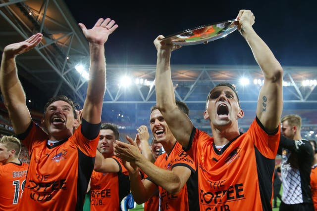 Liam Miller, right, celebrating winning the Premiers Plate with Brisbane Roar