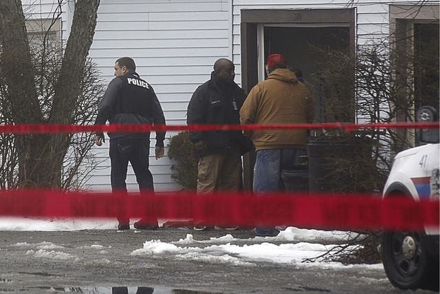 Authorities investigate the scene of a shooting where two Westerville, Ohio, police officers were shot and killed on 10 February 2018.