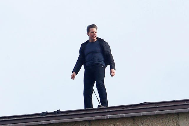 Tom Cruise on top of a chimney at the Tate Modern art gallery in London, shooting scenes for the forthcoming Mission: Impossible 6
