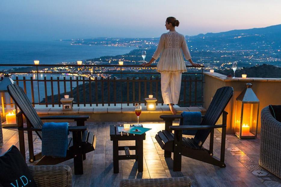 The east coast of Sicily is spread out before your candlelit balcony