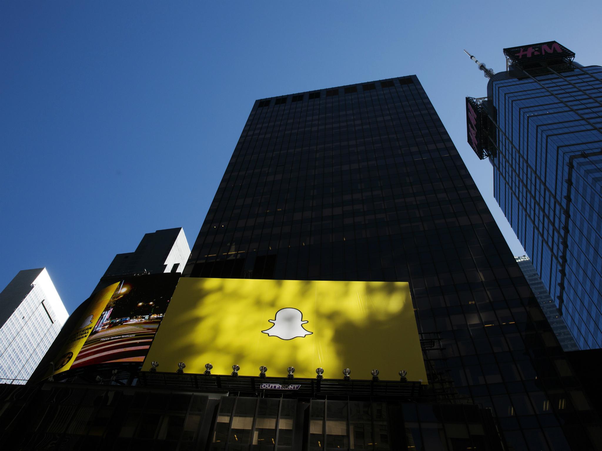 A billboard displays the logo of Snapchat above Times Square in New York March 12, 2015