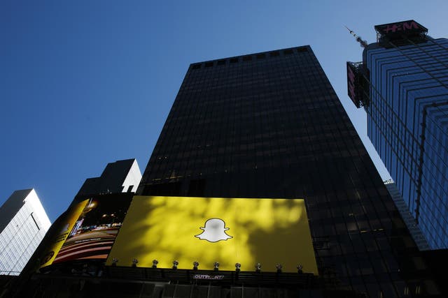 A billboard displays the logo of Snapchat above Times Square in New York March 12, 2015