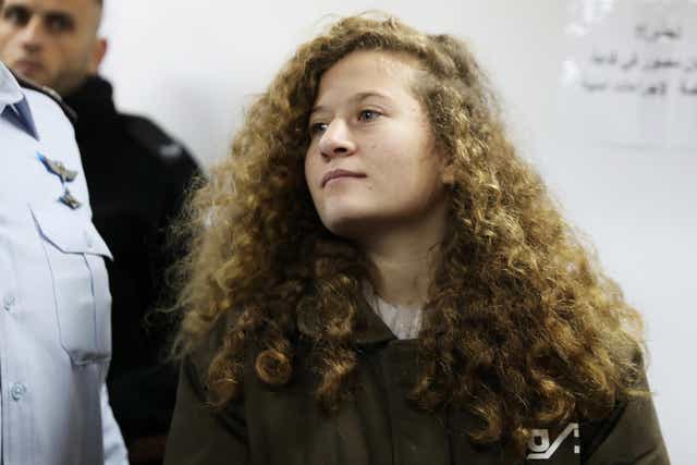 Palestinian teenager Ahed Tamimi enters a military courtroom at Ofer Prison, near the West Bank city of Ramallah, in a previous hearing on 15 January 2018