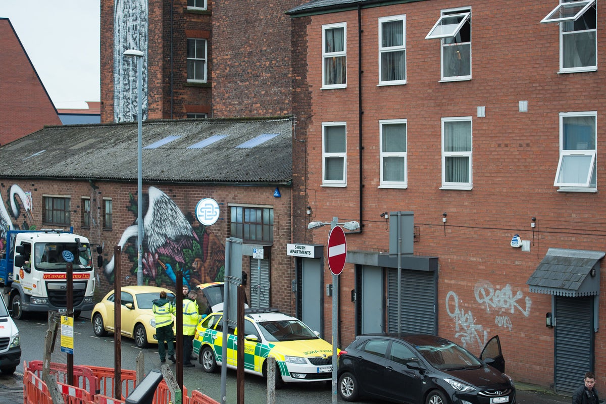Woman found dead in Manchester flat after 'blood covered man jumps from ...