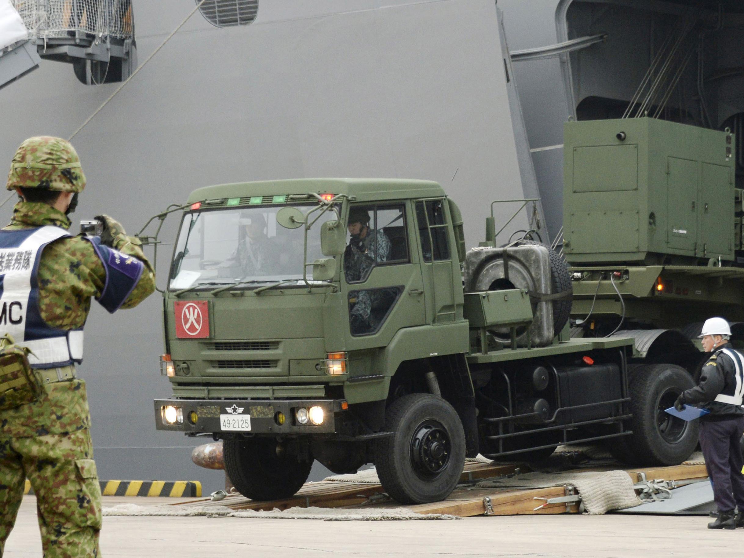 A Japanese Self-Defence Forces' vehicle carrying units of Patriot Advanced Capability-3 (PAC-3) missiles leaves a port on Japan's southern island of Ishigaki, Okinawa prefecture