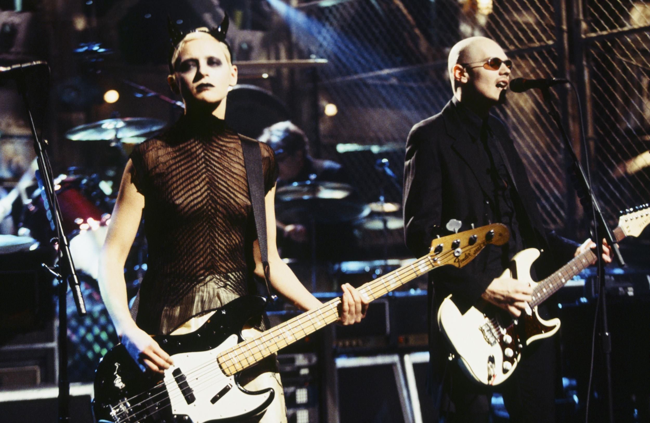 D'Arcy Wretzky performing with Billy Corgan in 1998. Credit: Getty