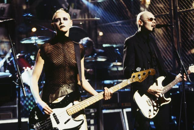 D'Arcy Wretzky performing with Billy Corgan in 1998. Credit: Getty