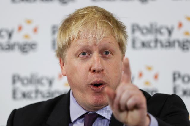 British Foreign Secretary Boris Johnson gestures as he delivers a speech in London