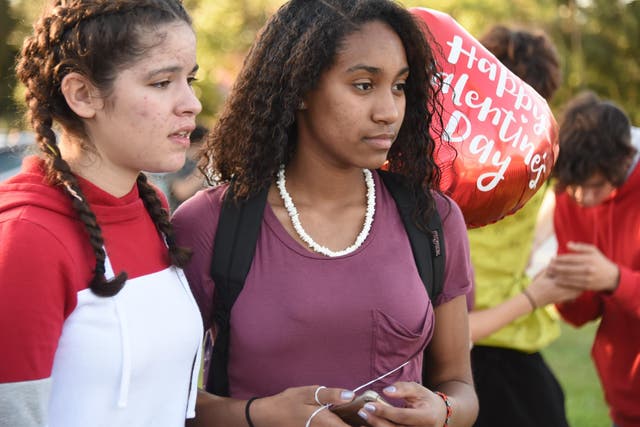 Students react  following a shooting at Marjory Stoneman Douglas High School in Parkland, Florida