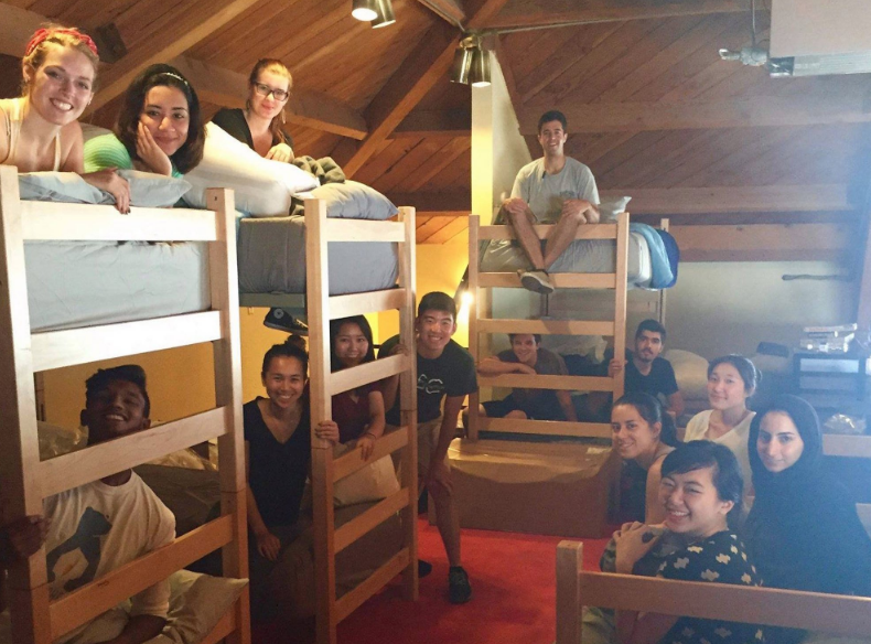 Temporary residents at Students for Students sleep in bunk beds in the loft of a refurbished church space.