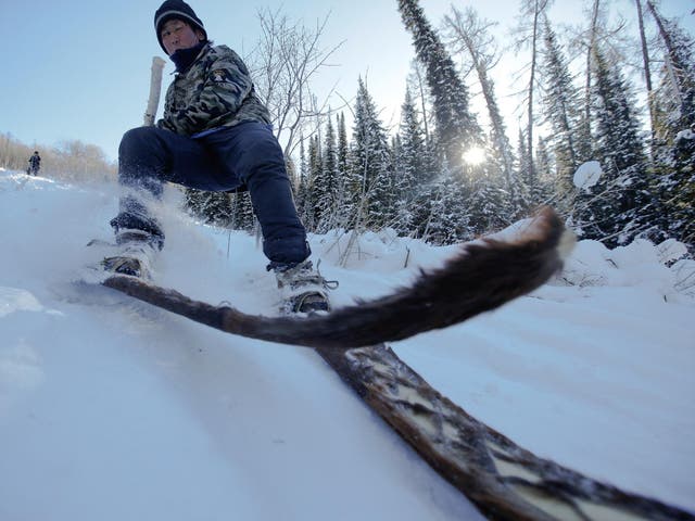 Horse-hide skis, like the ones being used here by Alimase, are traditional in the region