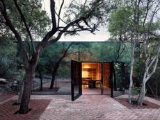 Sustainable mirrored home hides among the trees in Mexico