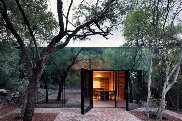 Los Terrenos uses reflective glass to create a seamless flow with the landscape