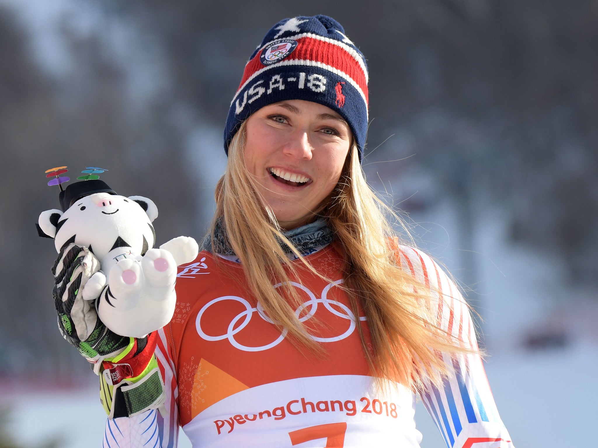 Mikaela Shiffrin holds up her Soohorang mascot after winning the women's Giant Slalom