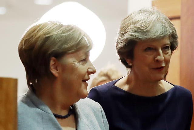 Theresa May (right) with German Chancellor Angela Merkel