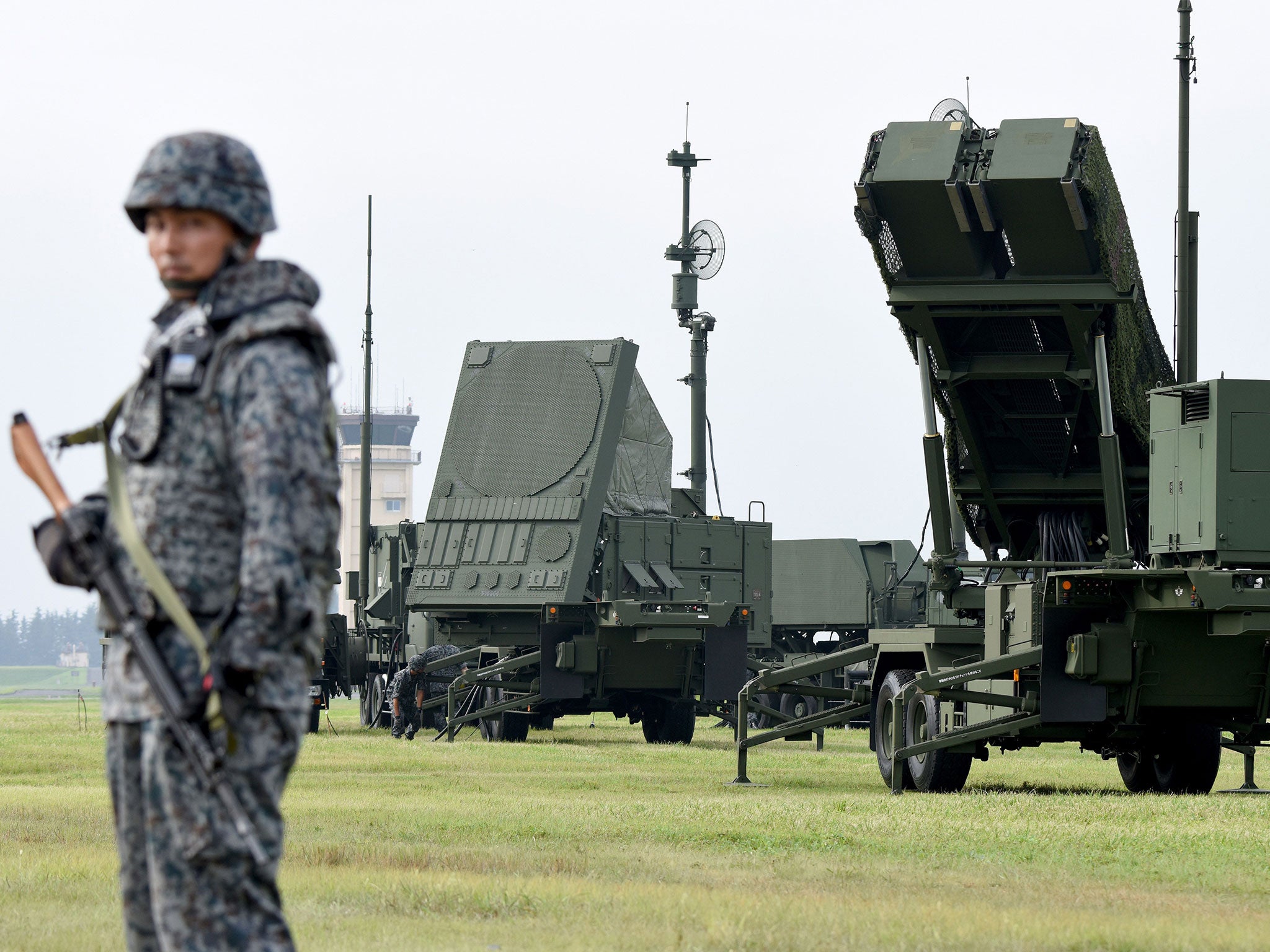 Soldiers from the Japan Air Self-Defence Force set up PAC-3 surface-to-air missile launch systems during a temporary deployment drill at US Yokota Air Bace in Tokyo