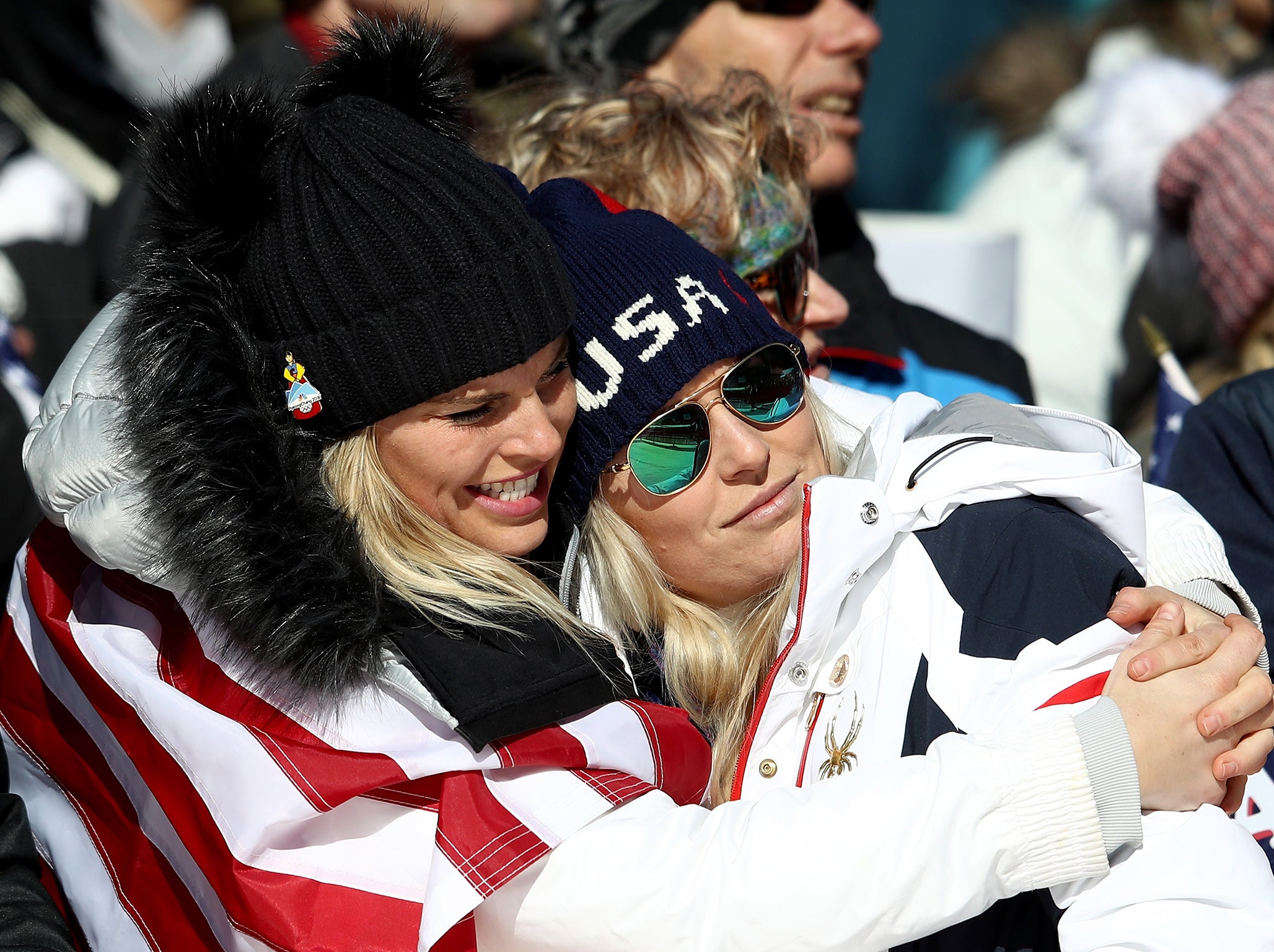 Lindsey Vonn (R) is consoled after missing out on a medal
