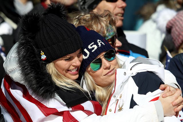 Lindsey Vonn (R) is consoled after missing out on a medal